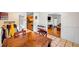 Dining area with hardwood floors, wooden table, and view into living room at 5392 Brickleberry Way, Douglasville, GA 30134