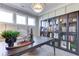 Home office with large windows and built-in glass-front bookcase at 155 Sunshower Rdg, Canton, GA 30114