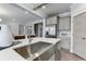 Modern kitchen with farmhouse sink and gray cabinets at 155 Sunshower Rdg, Canton, GA 30114