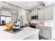 Modern kitchen with stainless steel appliances and white quartz countertops at 155 Sunshower Rdg, Canton, GA 30114