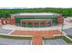 Aerial view of a large brick building with a parking lot at 253 N Gwinnett St, Buford, GA 30518