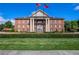 Buford City Hall, a stately brick building with columns and landscaping at 253 N Gwinnett St, Buford, GA 30518