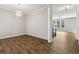 Dining room featuring hardwood floors, chandelier, and neutral walls at 253 N Gwinnett St, Buford, GA 30518