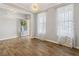 Spacious dining room with hardwood floors and natural light at 253 N Gwinnett St, Buford, GA 30518