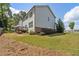 Two-story house with white siding, brick accents, and a deck at 253 N Gwinnett St, Buford, GA 30518