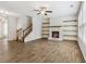 Spacious living room featuring a fireplace and built-in shelving at 253 N Gwinnett St, Buford, GA 30518