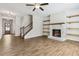 Spacious living room featuring a fireplace and built-in shelving at 253 N Gwinnett St, Buford, GA 30518