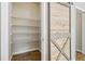 Walk-in pantry with wire shelving and barn door at 253 N Gwinnett St, Buford, GA 30518