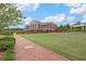 Brick pathway, lush green lawn, and community center at 253 N Gwinnett St, Buford, GA 30518