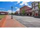 Brick-paved street with historic buildings and shops at 253 N Gwinnett St, Buford, GA 30518