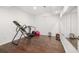 Home gym with various workout equipment and large mirrors at 5507 Ashleigh Walk Nw Dr, Suwanee, GA 30024