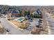 Aerial view of community pool with surrounding homes and parking at 5507 Ashleigh Walk Nw Dr, Suwanee, GA 30024