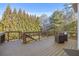 Relaxing deck overlooking wooded backyard with seating area at 5507 Ashleigh Walk Nw Dr, Suwanee, GA 30024