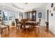 Formal dining room featuring hardwood floors and a large chandelier at 5507 Ashleigh Walk Nw Dr, Suwanee, GA 30024