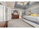 Spacious main bedroom with large bed, dresser, and ensuite bathroom access at 5507 Ashleigh Walk Nw Dr, Suwanee, GA 30024