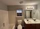 Bathroom with double vanity and shower/tub combo at 4461 Ravenwood Dr, Union City, GA 30291