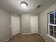 Well-lit bedroom with two closets and a window at 4461 Ravenwood Dr, Union City, GA 30291