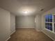 Spacious bedroom with neutral walls and carpet at 4461 Ravenwood Dr, Union City, GA 30291