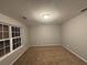 Simple bedroom with carpet and window at 4461 Ravenwood Dr, Union City, GA 30291