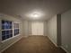 Bright bedroom featuring double doors and a window at 4461 Ravenwood Dr, Union City, GA 30291