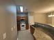 Bright kitchen boasts granite countertops, wood cabinets, and white appliances at 4461 Ravenwood Dr, Union City, GA 30291