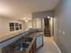 Modern kitchen with granite countertops, stainless steel appliances, and ample cabinetry at 4461 Ravenwood Dr, Union City, GA 30291