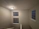 Upstairs hallway with multiple windows at 4461 Ravenwood Dr, Union City, GA 30291