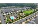 Aerial view of community with houses, pool, and green space at 1072 Heyward Way, Alpharetta, GA 30009