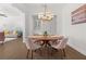 Open concept dining room with view into the living room at 1072 Heyward Way, Alpharetta, GA 30009