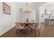 Bright dining room with wooden table and light pink chairs at 1072 Heyward Way, Alpharetta, GA 30009