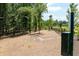 Fenced dog park with wood chips and waste disposal at 1072 Heyward Way, Alpharetta, GA 30009