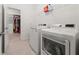 Laundry room with washer, dryer, and additional storage at 1072 Heyward Way, Alpharetta, GA 30009