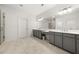 Double vanity bathroom with grey cabinets and a large walk-in shower at 1072 Heyward Way, Alpharetta, GA 30009