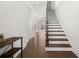 Elegant hardwood staircase with white risers and railing at 1072 Heyward Way, Alpharetta, GA 30009