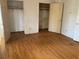 Simple bedroom with hardwood floors and double closets at 4617 Cedar Park Dr, Stone Mountain, GA 30083