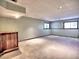 Finished basement features a wet bar and neutral carpeting at 1550 Oak Creek Dr, Marietta, GA 30066