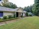 Community clubhouse with a manicured lawn at 1550 Oak Creek Dr, Marietta, GA 30066