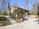 Side view of house with garage and landscaping at 1550 Oak Creek Dr, Marietta, GA 30066