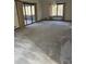 Large living room with wall-to-wall carpet, fireplace and access to a sunroom at 1550 Oak Creek Dr, Marietta, GA 30066