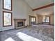 Spacious living room featuring a stone fireplace and large windows at 1550 Oak Creek Dr, Marietta, GA 30066