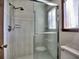 Shower with glass enclosure and tiled walls at 1550 Oak Creek Dr, Marietta, GA 30066