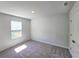 Cozy bedroom featuring carpeted floors, window, and a closet at 2422 Brown Dove Way Lot 70, Grayson, GA 30017