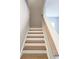 Elegant staircase with wood treads and white risers leading to the upper level at 2422 Brown Dove Way Lot 70, Grayson, GA 30017