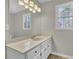 Bright bathroom with a large mirror and a single sink vanity at 4810 Winding Ln, Powder Springs, GA 30127