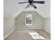 Bedroom with an angled ceiling and a ceiling fan at 4810 Winding Ln, Powder Springs, GA 30127