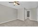 Neutral bedroom featuring a ceiling fan with an attached ensuite bathroom at 4810 Winding Ln, Powder Springs, GA 30127