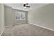 Neutral bedroom with a ceiling fan and a bright window at 4810 Winding Ln, Powder Springs, GA 30127