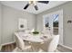 Cozy dining room with a modern table set and french doors to the back yard deck at 4810 Winding Ln, Powder Springs, GA 30127