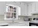 Well lit kitchen with granite counters, stainless steel appliances, and modern sink faucet at 4810 Winding Ln, Powder Springs, GA 30127