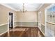 Formal dining room with hardwood floors and chandelier at 255 Southshore Ln, Dallas, GA 30157